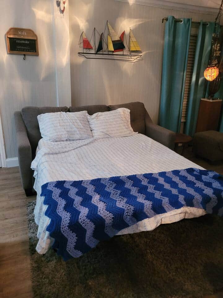 Queen size pull out sofa in living room.