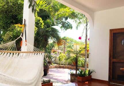 Shaded front porch with hammock swing Shaded front porch with hammock swing