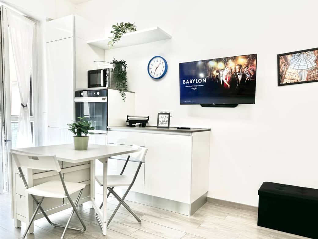 Open space kitchen connected with the living room and entrance. Sofa bed in this area.