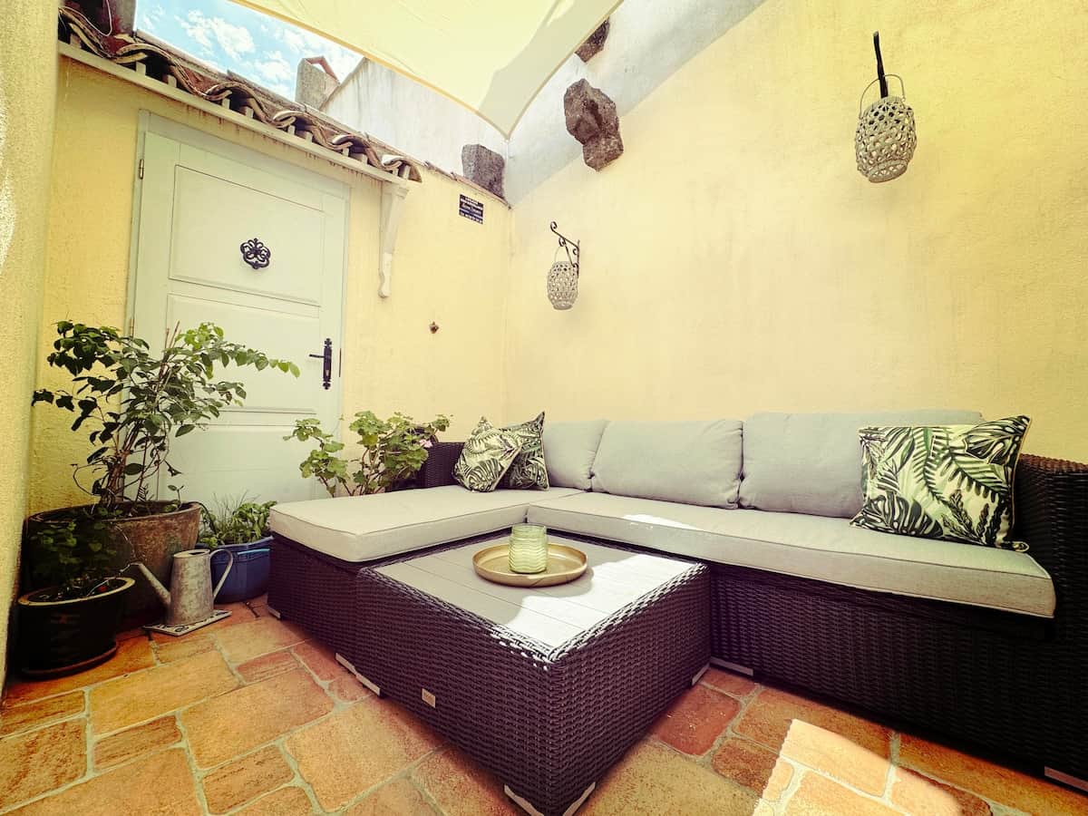 A second-floor terrace with a comfortable sofa — the perfect spot for an evening of relaxation