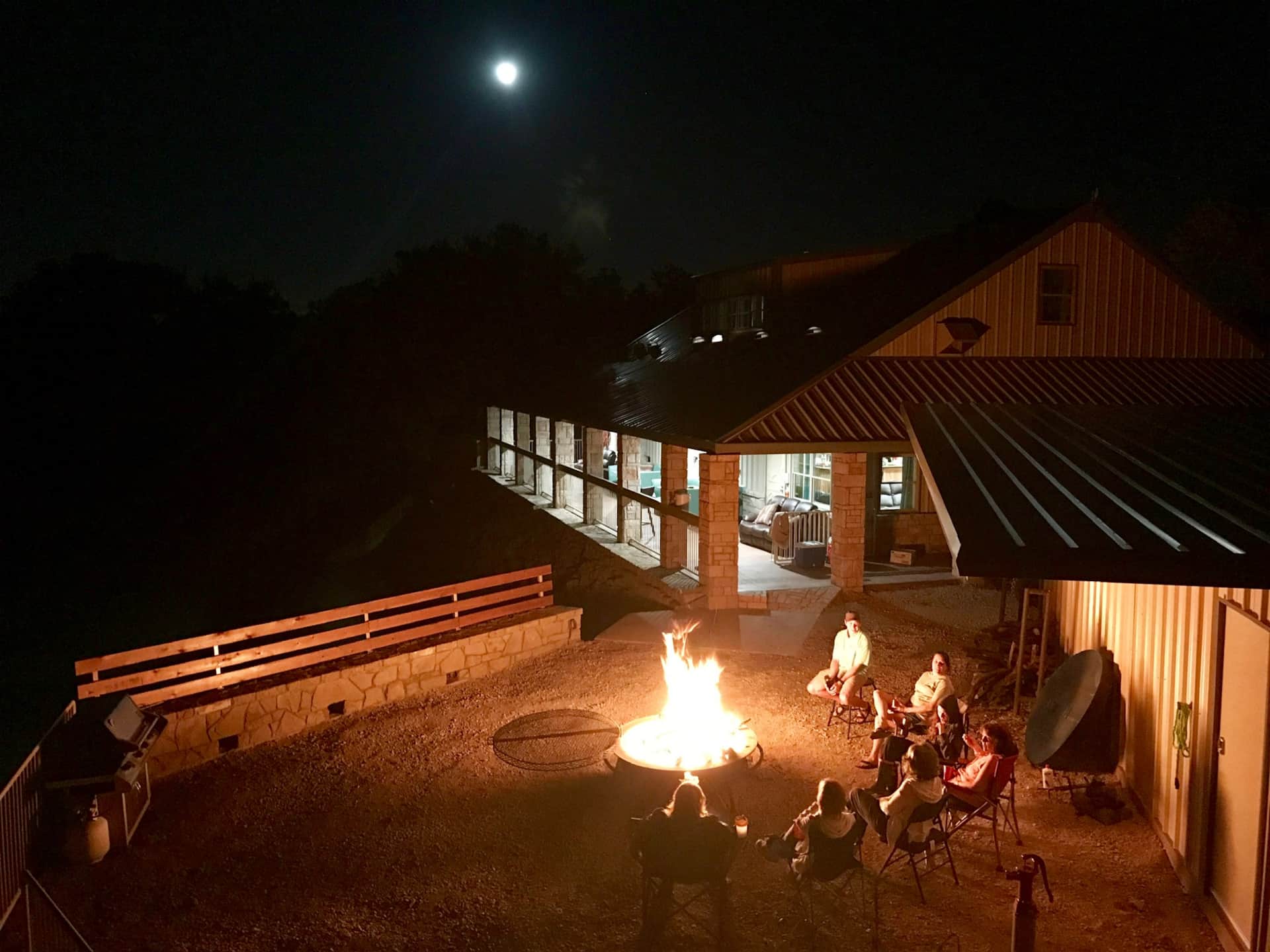 Moonlit fire pit fellowship by church family at Lake Godstone lodge firepit Graford Texas