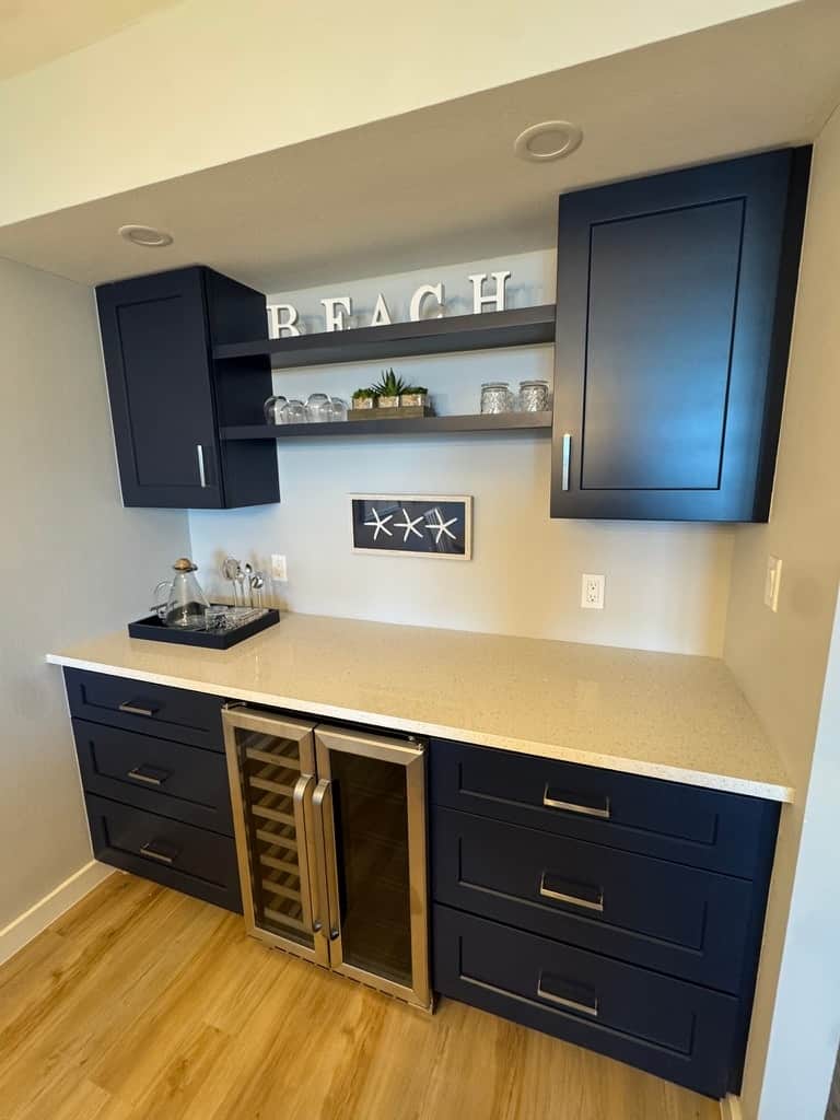 Dedicated beverage center with coffee setup, storage and wine refrigerator.