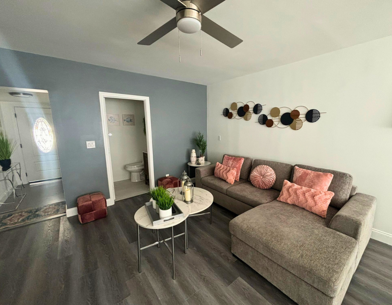 Bright living room with a large sofa and stylish decorative artwork. Lakeland, FL
