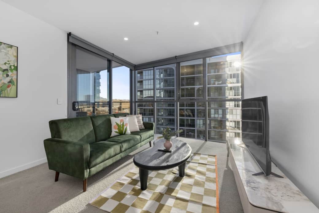 The living room includes one couch, one big coffee table, one tv and TV stand.