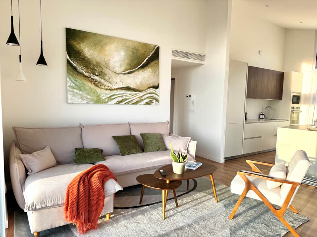Open-plan living, dining, and kitchen space filled with natural light. Open-plan living, dining, and kitchen space filled with natural light.
