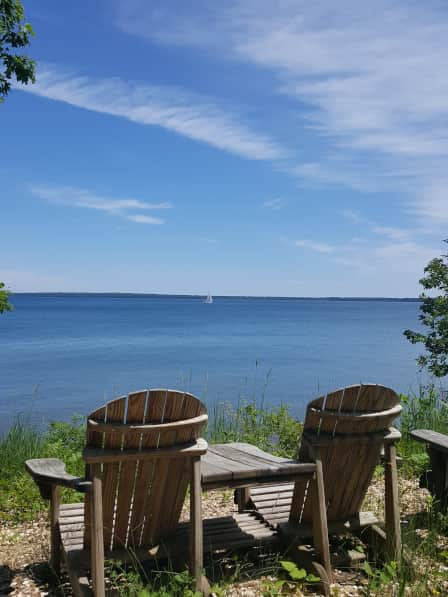 Adirondacks and sailboat