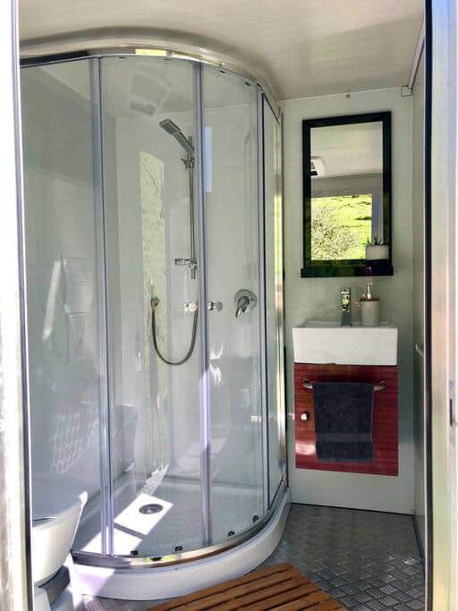 Hot shower & flushing toilet.