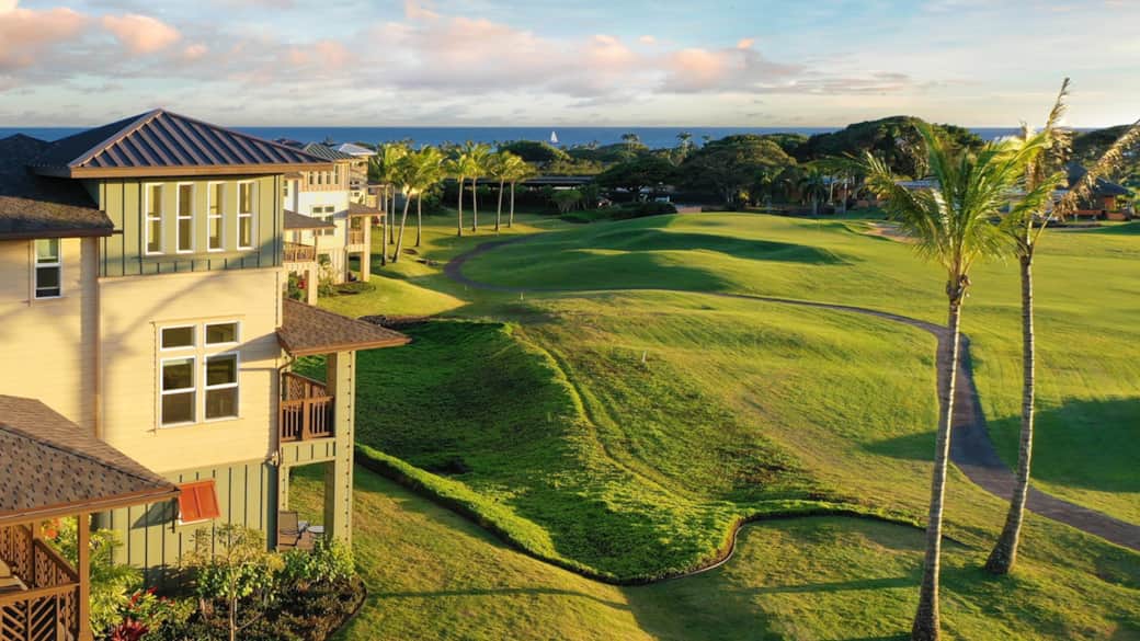 Aerial view of Pili Mai and the Kiahuna Golf Course 9th hole fairway and green at golden hour