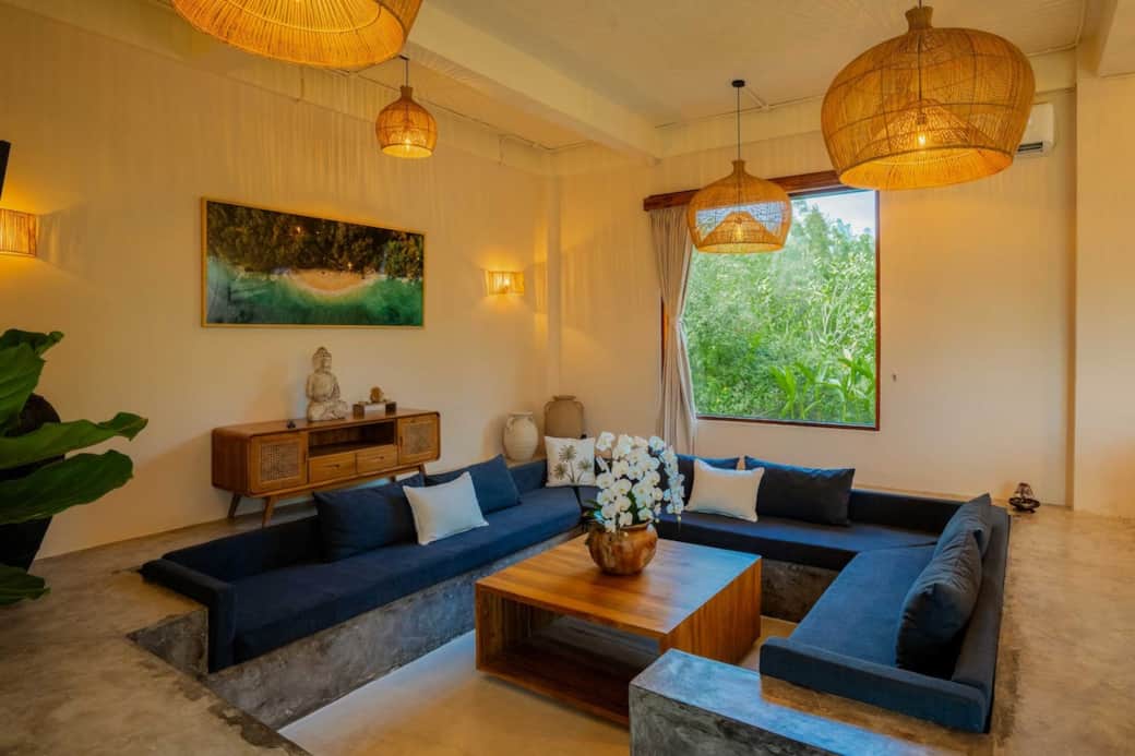 Sink into comfort in our cozy sunken lounge—perfect for conversations, reading, or evening cocktails. Surrounded by tropical views, it’s your serene sanctuary in Bali.
