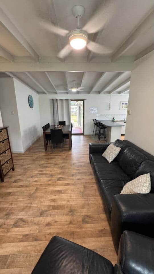 To make the most of the ocean breezes, every room has a ceiling fan.  Indoor dining and a second living room with a television are located here.