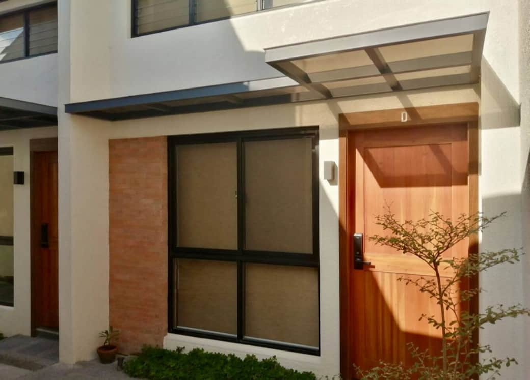 The Airbnb's exterior is a lush paradise, featuring bamboo, century plants, African talisay, Rhapis palms, and flowering peanut plants. The landscape exudes tranquility and beauty, offering guests a serene retreat amidst nature's embrace.