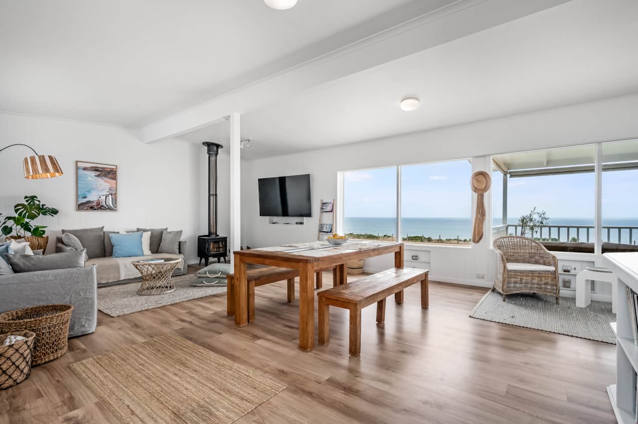 Open plan living upstairs with panoramic sea view