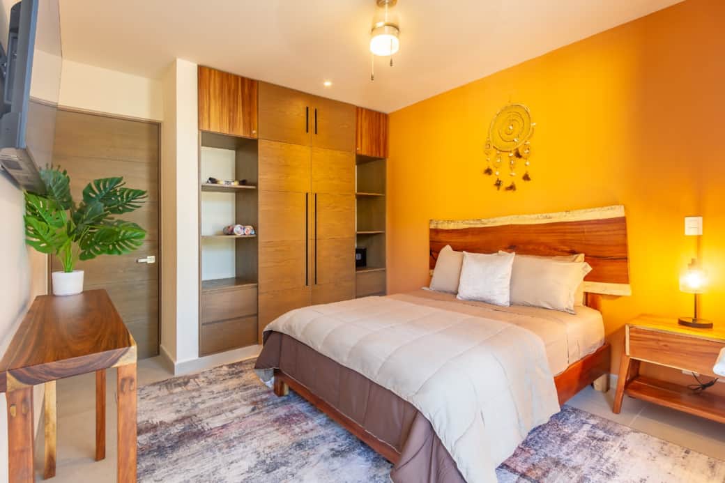 Master bedroom oasis: wardrobe wall closet, safe, AC for perfect comfort.