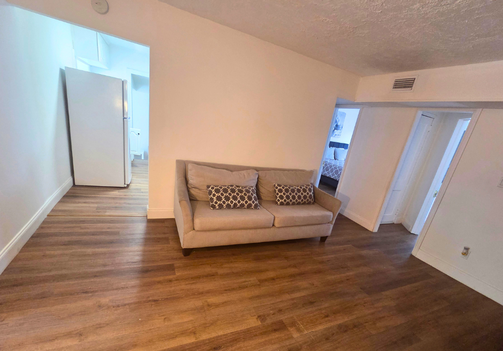 Spacious sofa with decorative pillows for added comfort and relaxation. Lakeland, FL