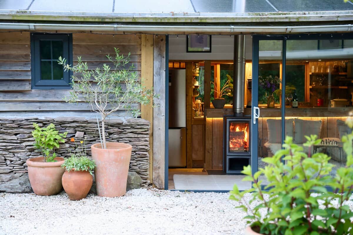 Garden looking in on the lounge, cosy fire place