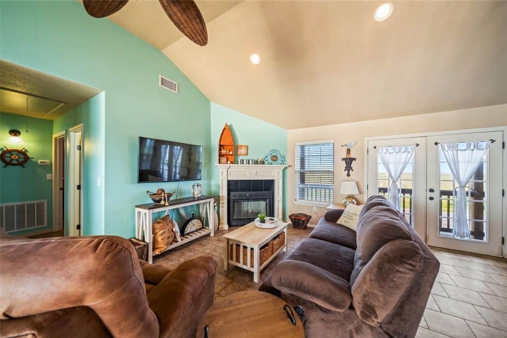 The living area is centered around a streaming TV and fireplace. The living area is centered around a streaming TV and fireplace.