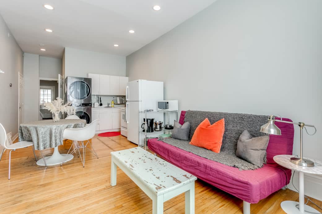 Welcoming living room in a Toronto short-term rental, bathed in natural light.