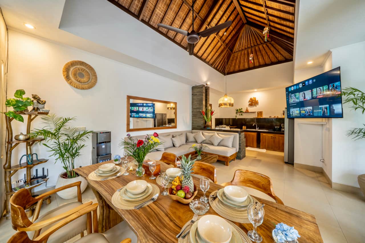 An open-plan living and dining area with the kitchen close at hand.