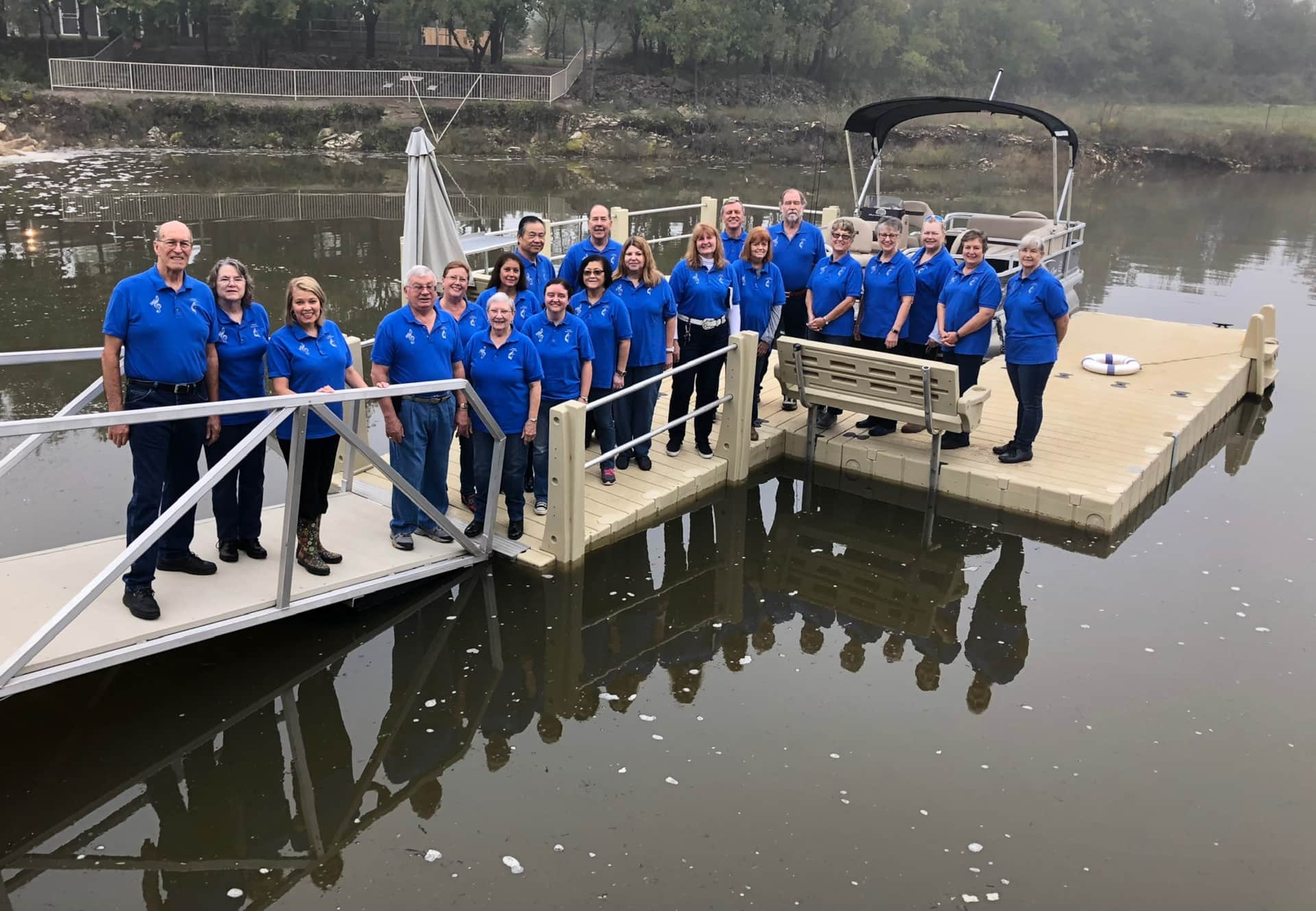Texas church choir retreat group on the dock of the 35-bed lodge at Lake Godstone Graford TX