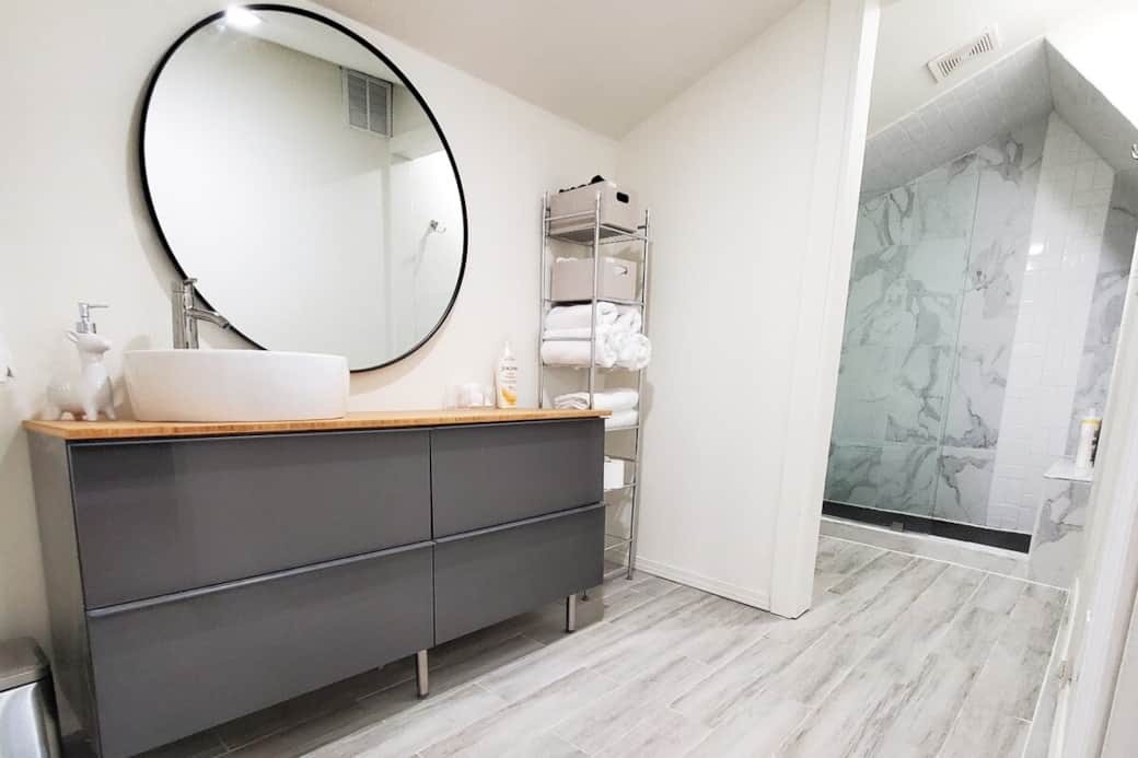 Main Bathroom with extra storage in vanity. Towels, wash clothes, soap, shampoo, conditioner and blow dryer available for use. 