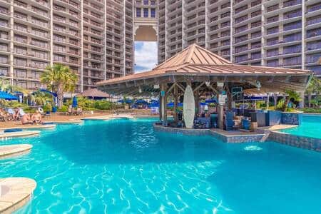 Iconic swim-up pool bar surrounded by the resort’s expansive oceanfront pool deck.