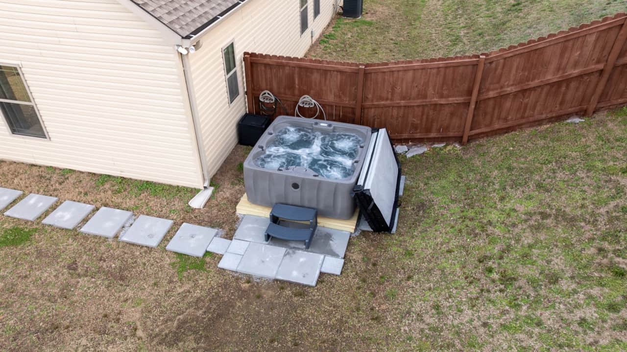 6 Person Hot Tub & Back Yard