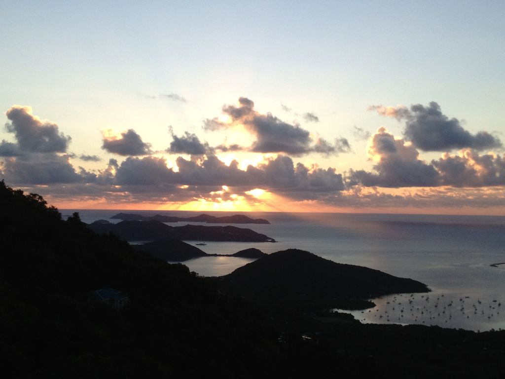 Sunrise over Coral Bay from veranda off ground level suite and pool deck