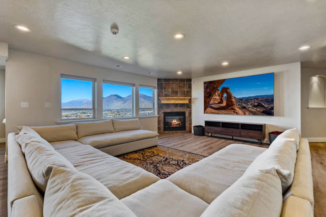 Downstairs Living Room with 98" TV and 12 Person Couch