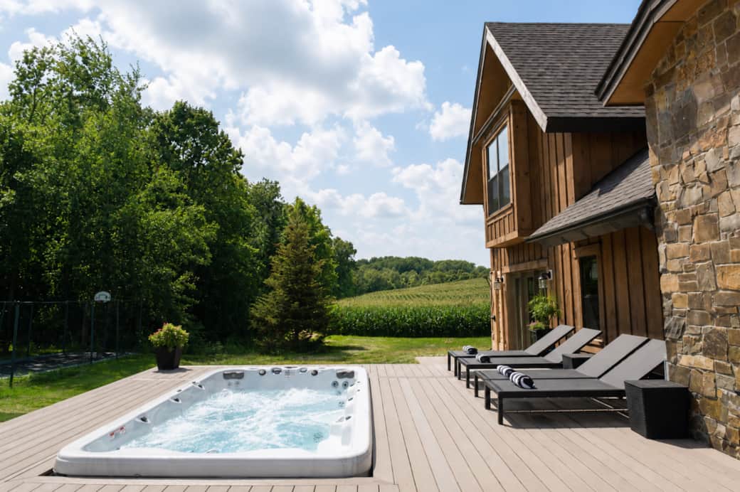 Back deck with swim spa and lounge chairs Back deck with swim spa and lounge chairs