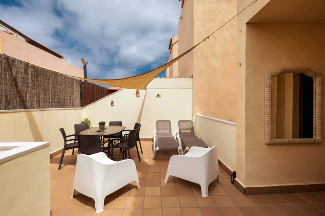 Large Rear Terrace with sun shades, BBQ, Dining area and loungers Large Rear Terrace with sun shades, BBQ, Dining area and loungers