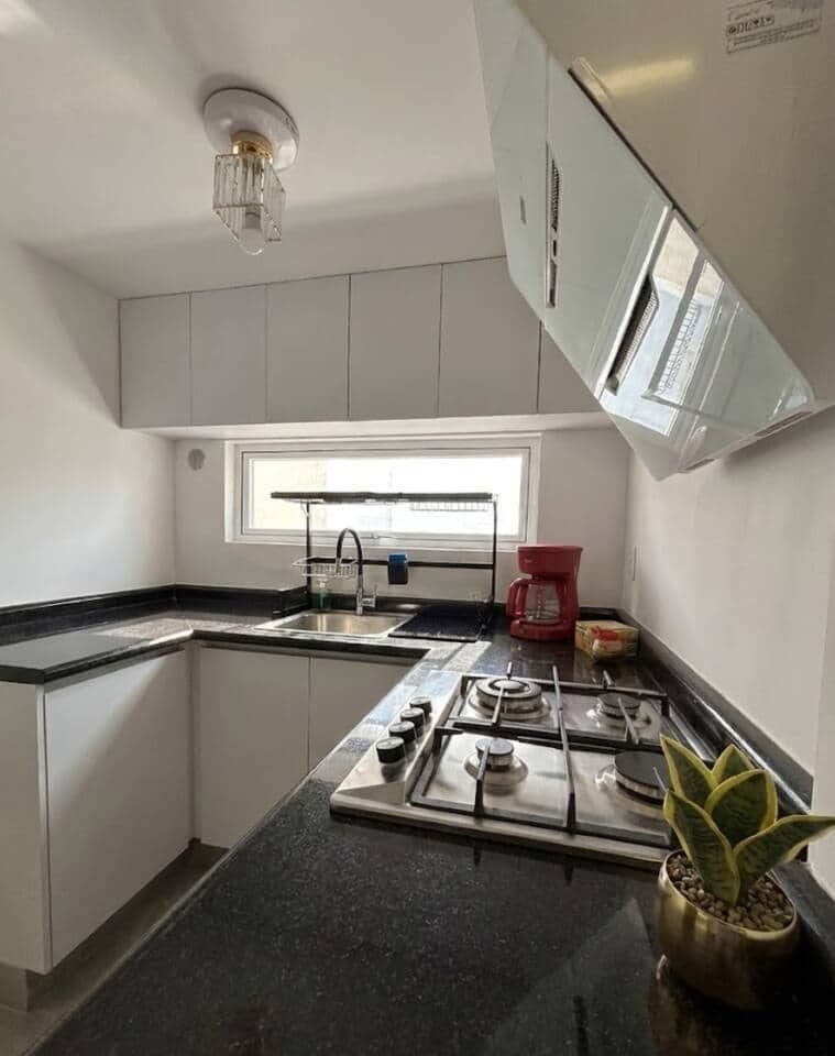 Kitchen sink set under a sunny window with a sleek faucet and practical drying rack—clean, functional, and perfect for cooking prep and daily use. Kitchen sink set under a sunny window with a sleek faucet and practical drying rack—clean, functional, and perfect for cooking prep and daily use.