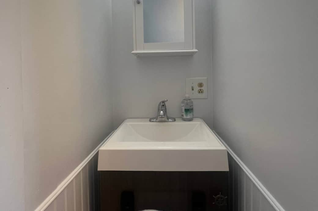 2nd floor. Small vanity sink in bathroom, upstairs. 