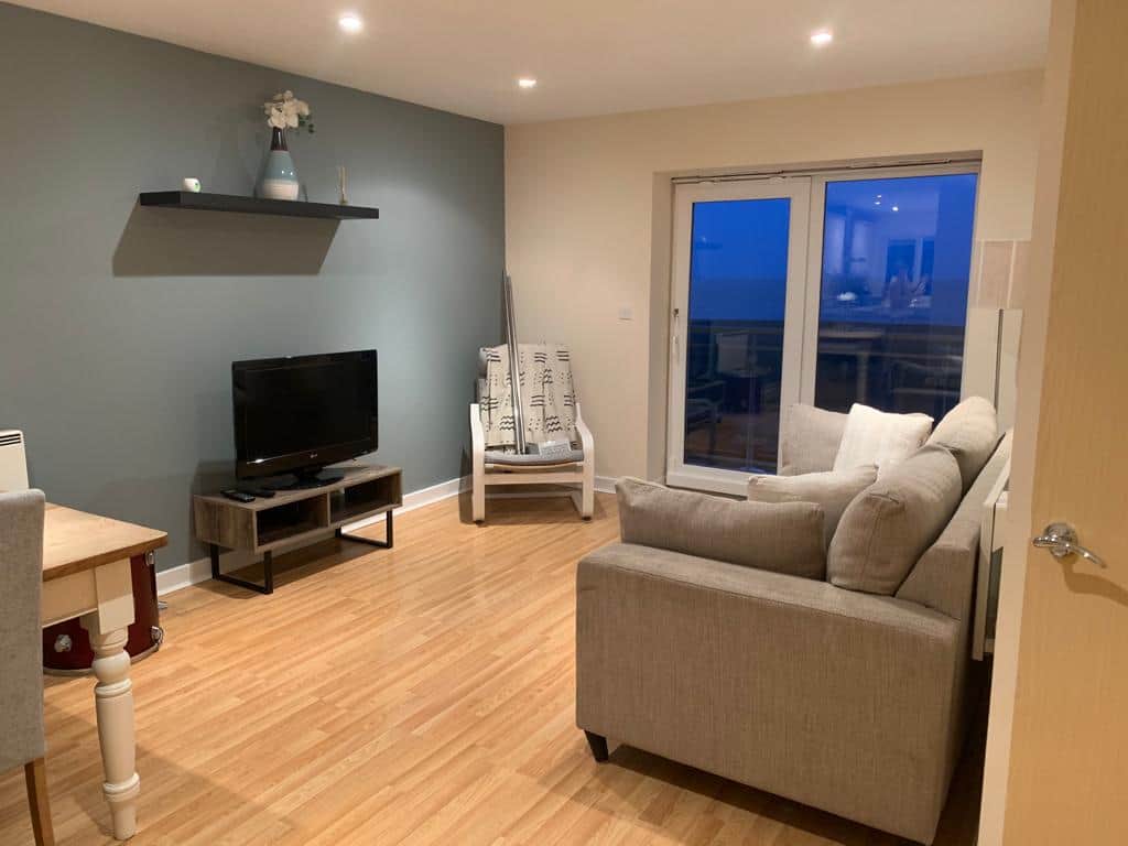 Living and dining room with balcony seaview