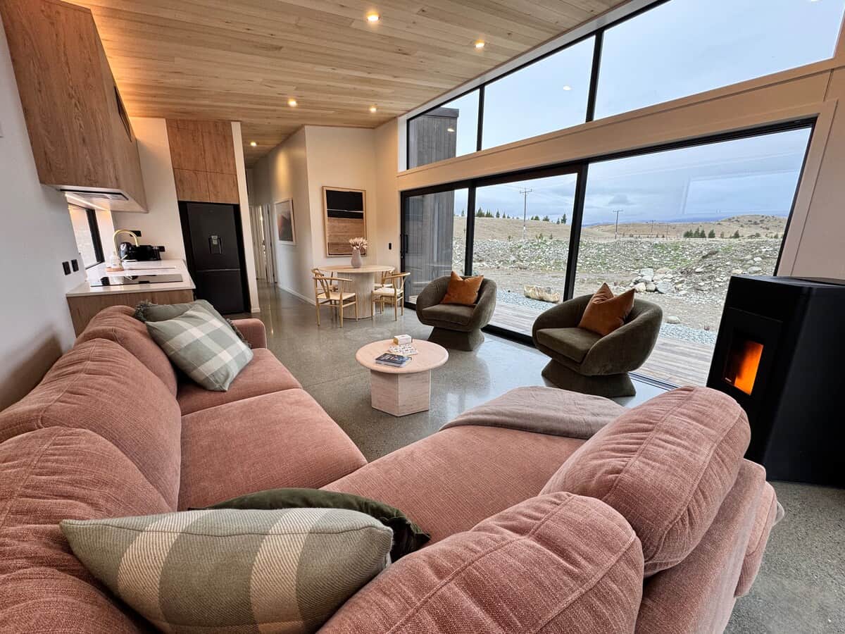 Comfortable living space with plenty of seating options, stunning views and a toasty warm fire for the cooler months