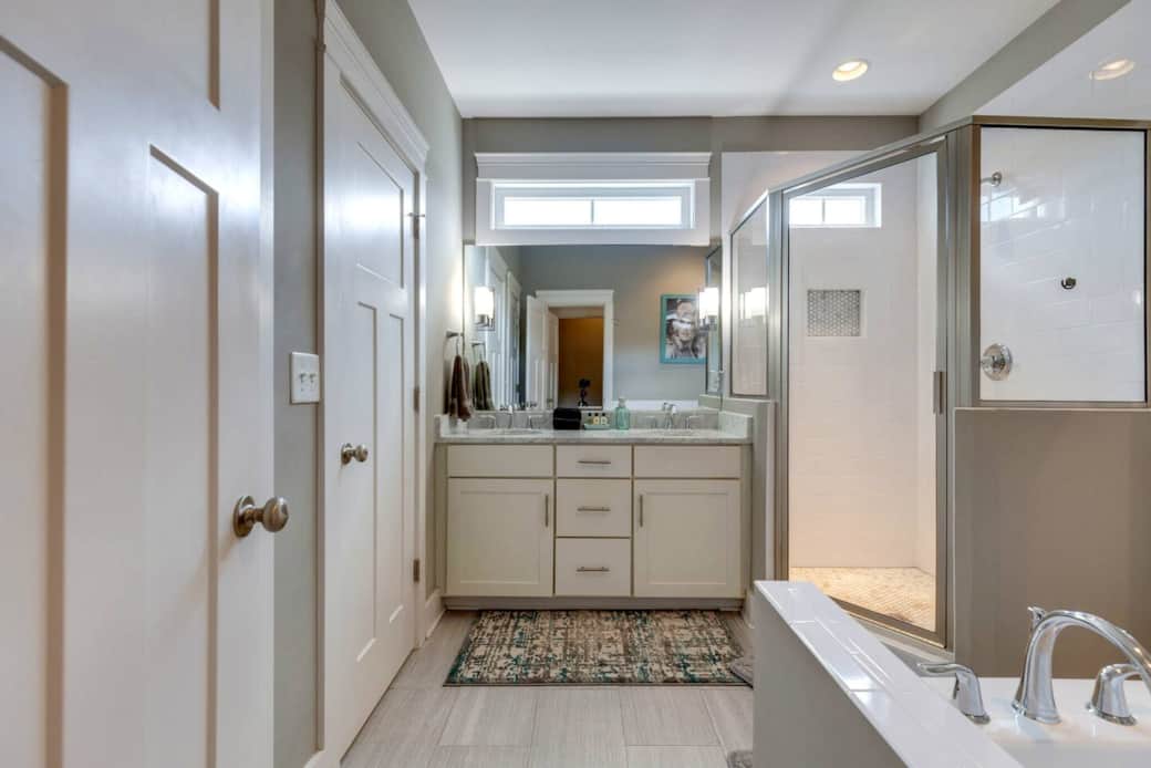 Primary bathroom with whirlpool tub and separate shower.