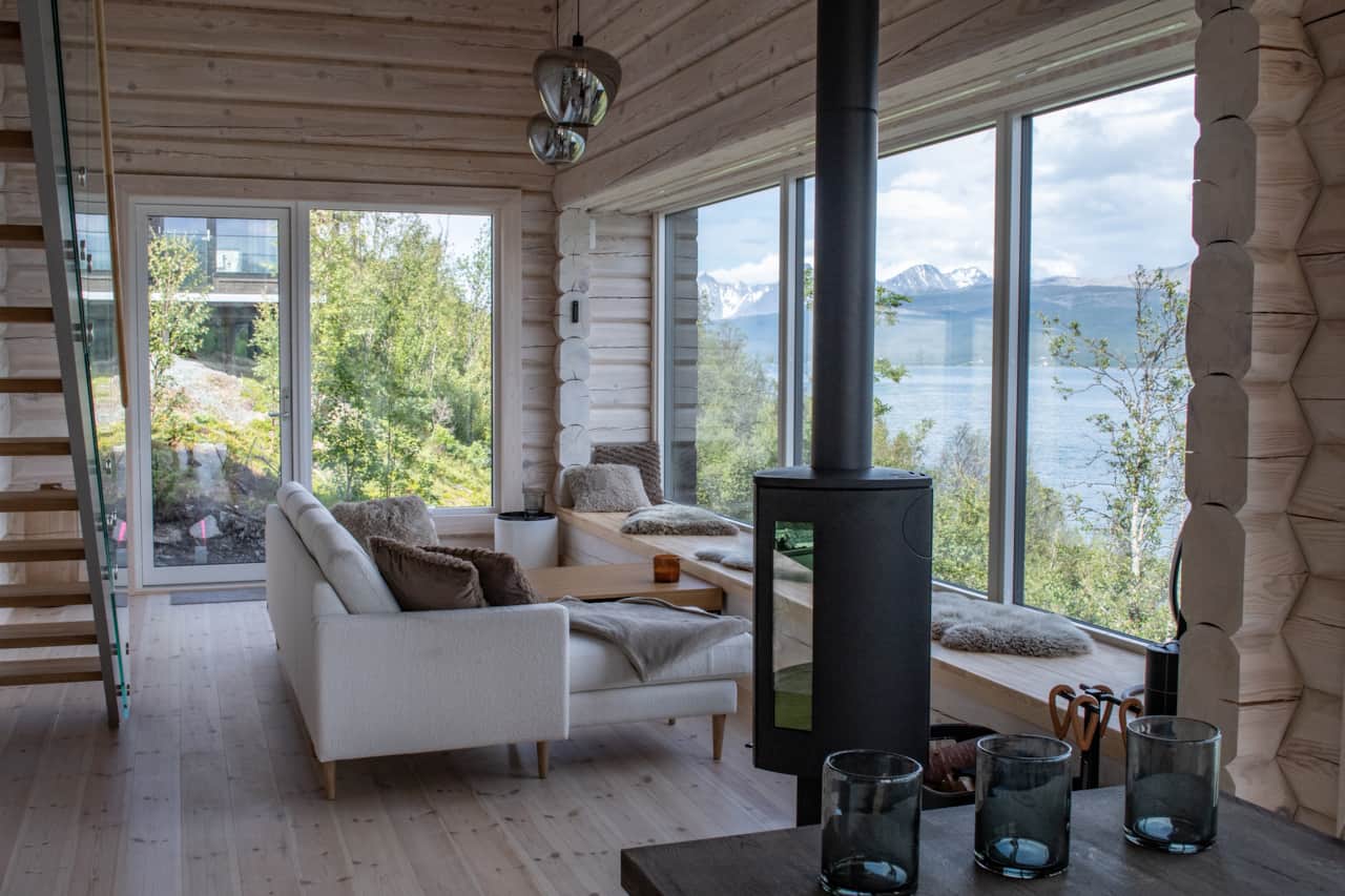 One fire, one sofa, one fjord. Reserve your nights at Bjørka.