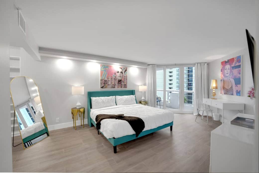 Largest Master bedroom with attached bathroom. King bed, 55" Roku streaming tv, private balcony access, desk, closet, vanity. 