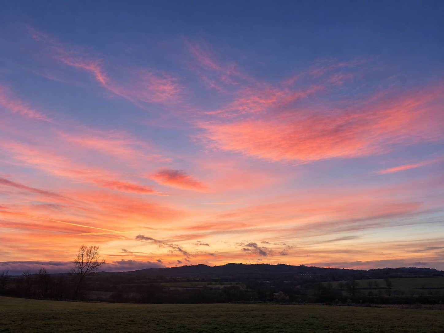 Spring sunset over the countryside at The Cotswold Barn