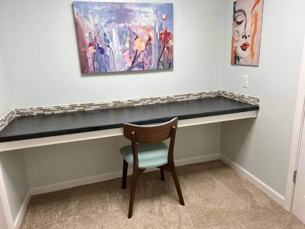 This large desk is in a room designated as the office only to allow for a quiet workspace. A printer is provided with a USB hook-up cable and paper provided.  Built-in shelving offers storage space for your projects.