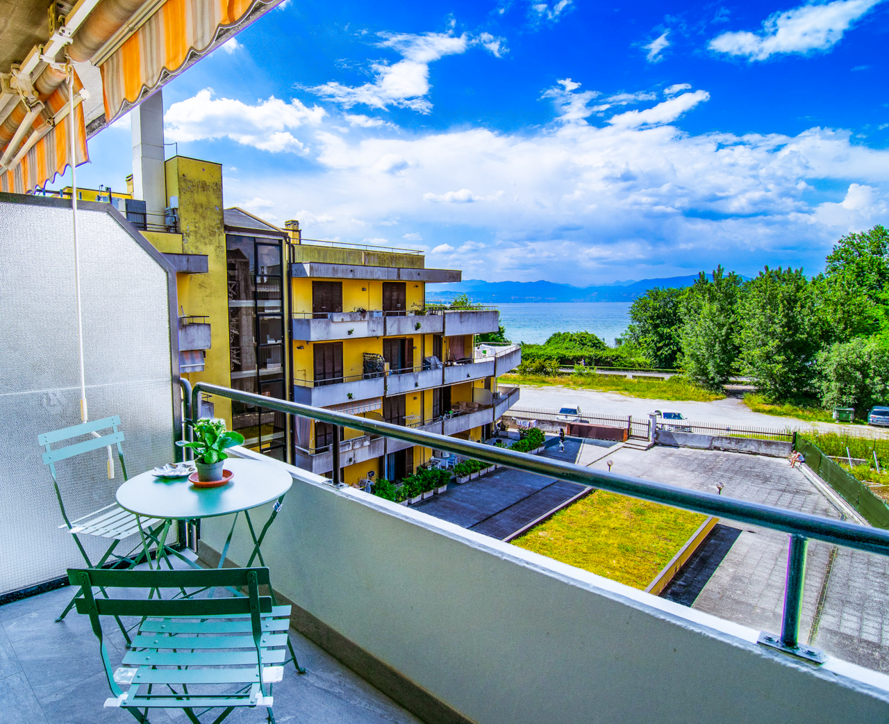 Balcony with lake view and table