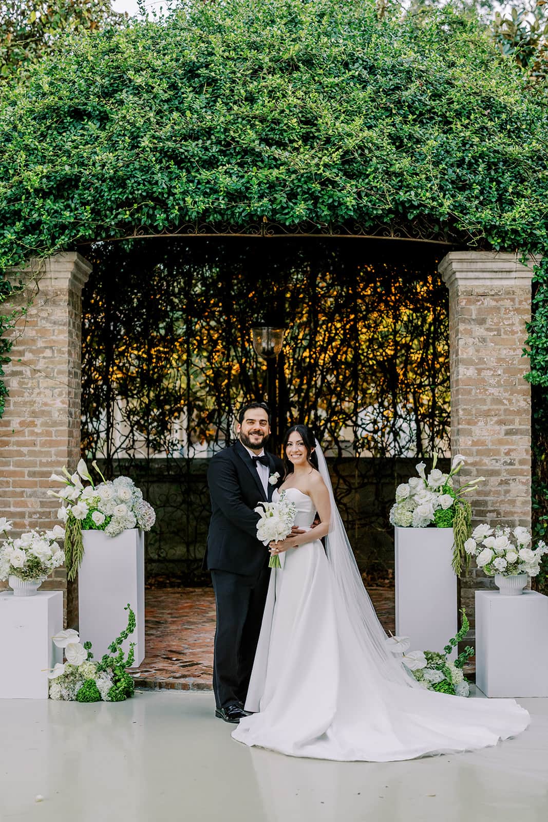 Bride and groom portrait in the courtyard at The Bryan Museum in Galveston during their wedding celebration