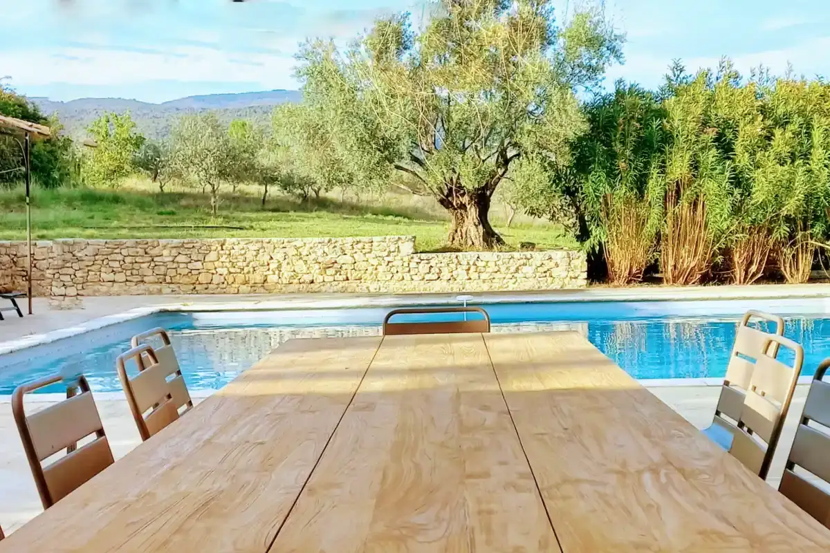 View of the heated swimming pool and the Luberon