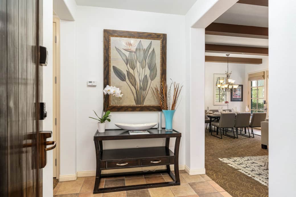 Tahiti Suite entry with elegant decor, warm tile flooring, and a clear view into the living spaces