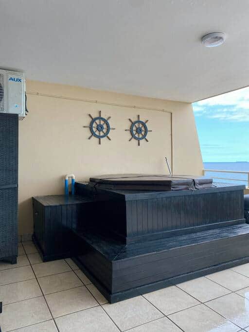 Relax in the unit's private hot tub. Enjoy the view while sipping on a cocktail in a hot tub.