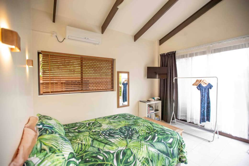 Comfy queen bed, a clothing rack for your holiday outfits and a trunk filled with towels. 