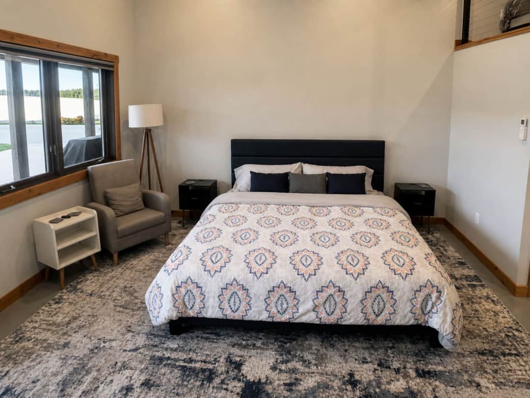 Comfortable sitting area & master featuring a luxury king-sized bed in the Black Hills, SD.