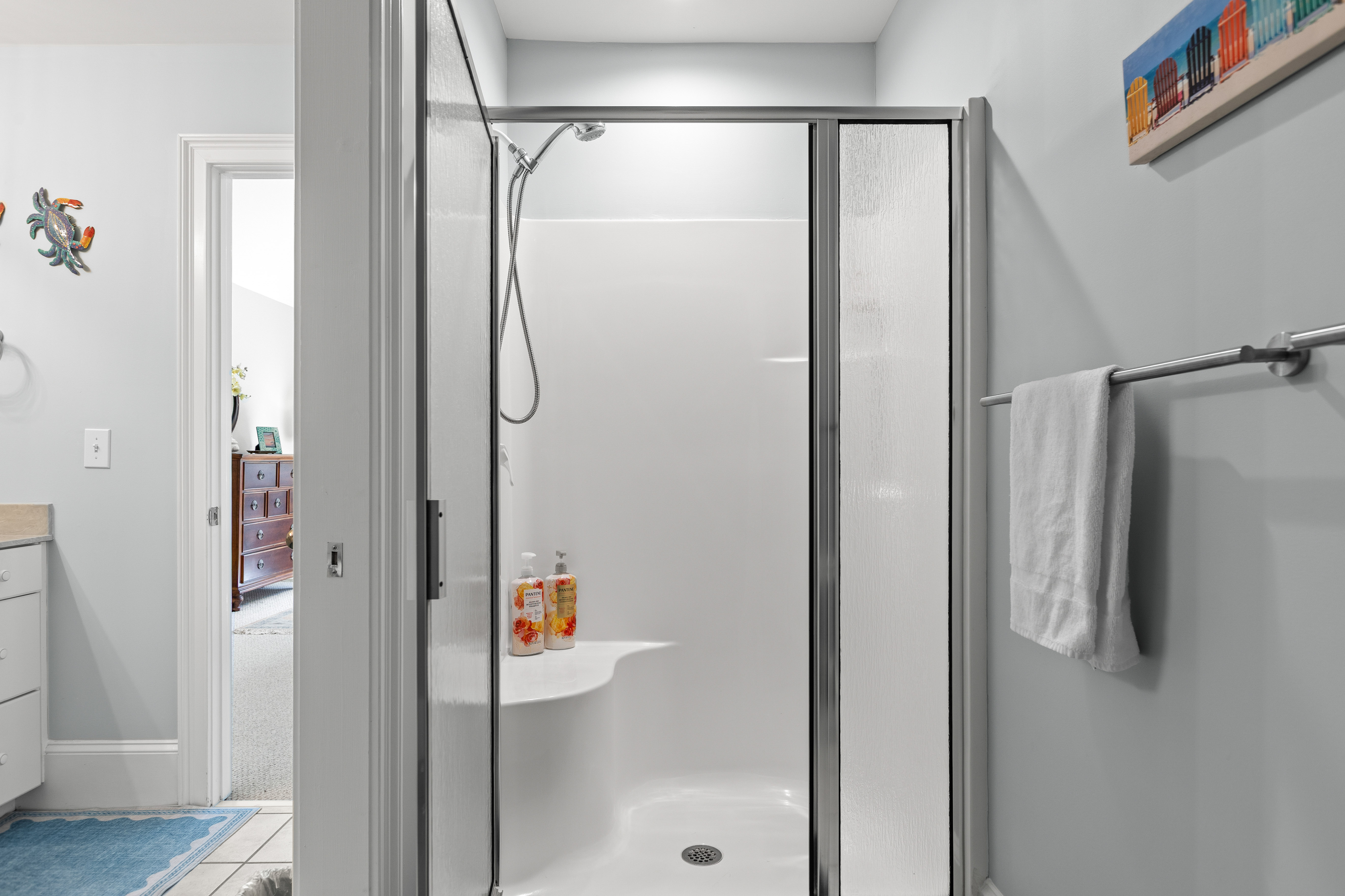 Walk-in shower behind glass