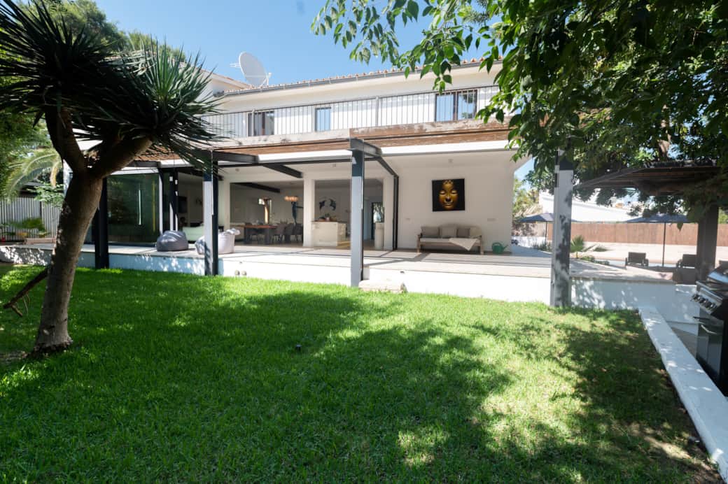 Garden lounge and exterior seating area at Casa Guindilla in Portals Nous, Mallorca