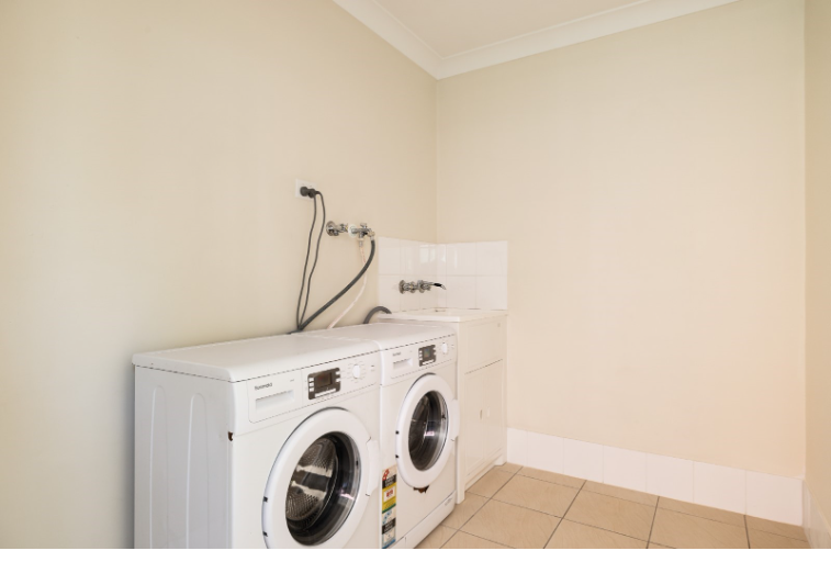 Shared Laundry Area: Washer available for convenient laundry needs