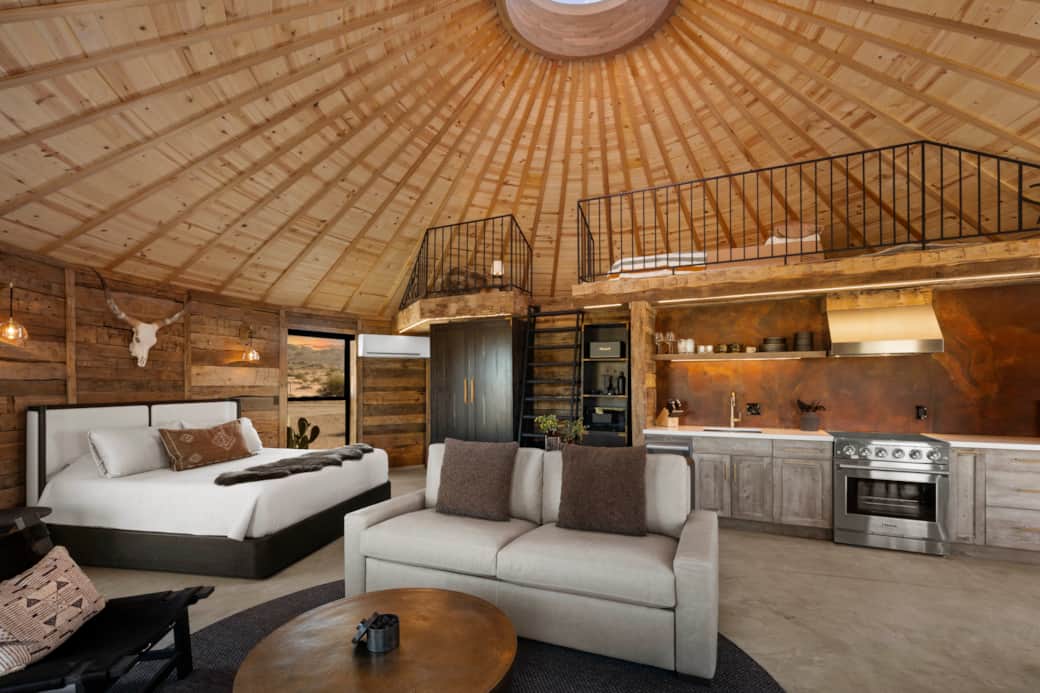 150-yr-old reclaimed beams, vaulted ceiling, retractable dome — fully Restoration Hardware